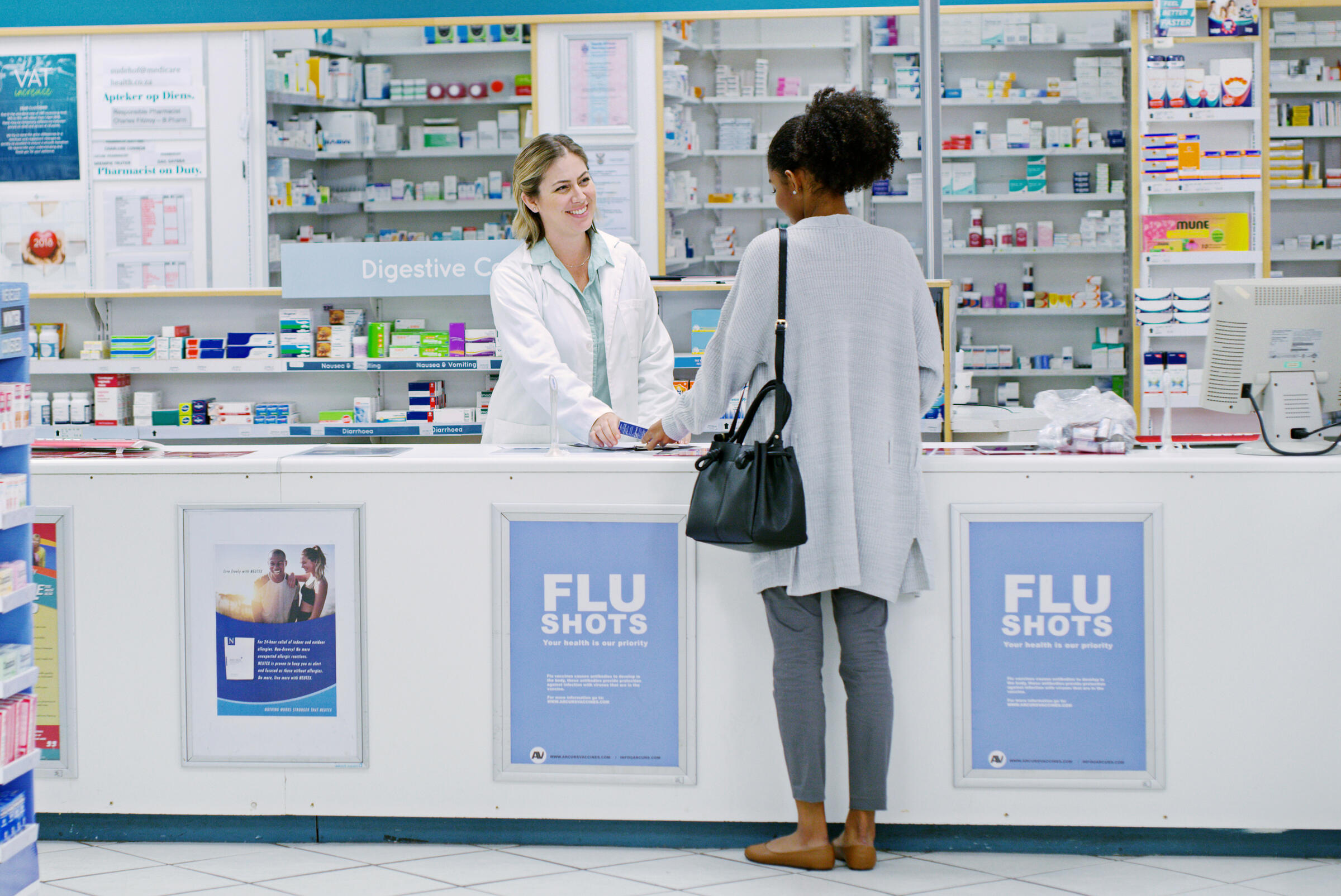 pharmacist helping customer